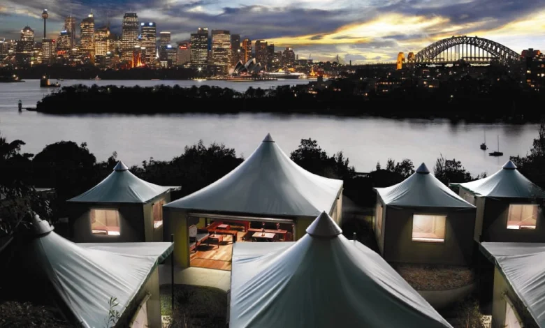 tents with a city in the background